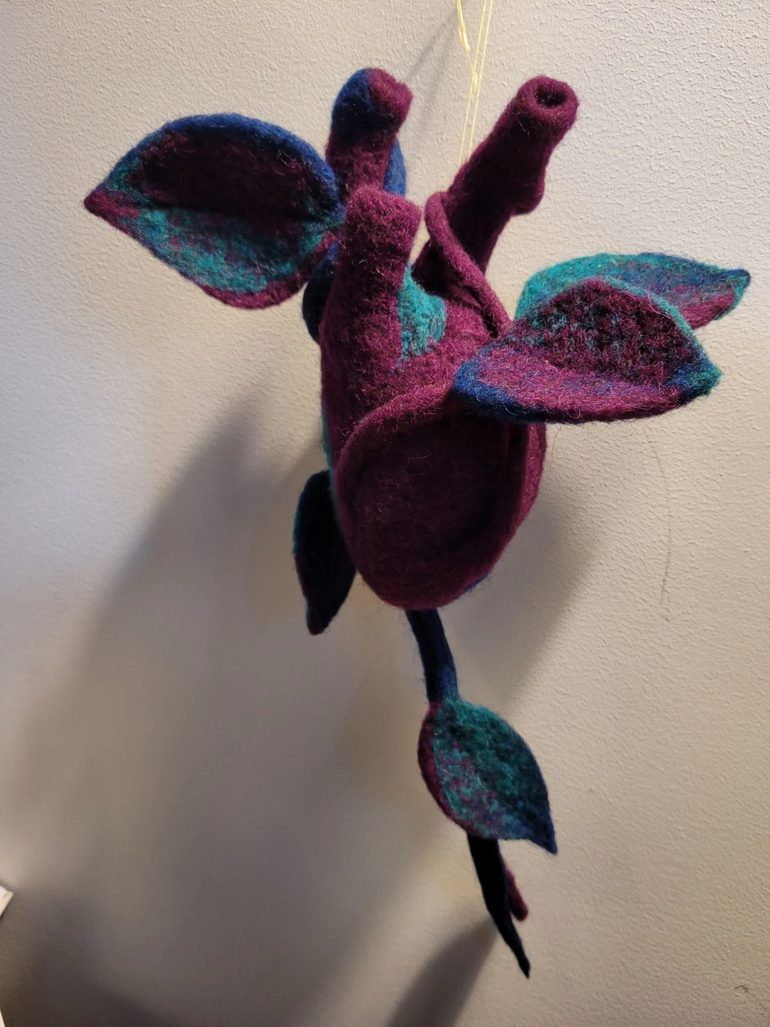 Needle-felted textile sculpture, an example of Red Thread's craftivism practice